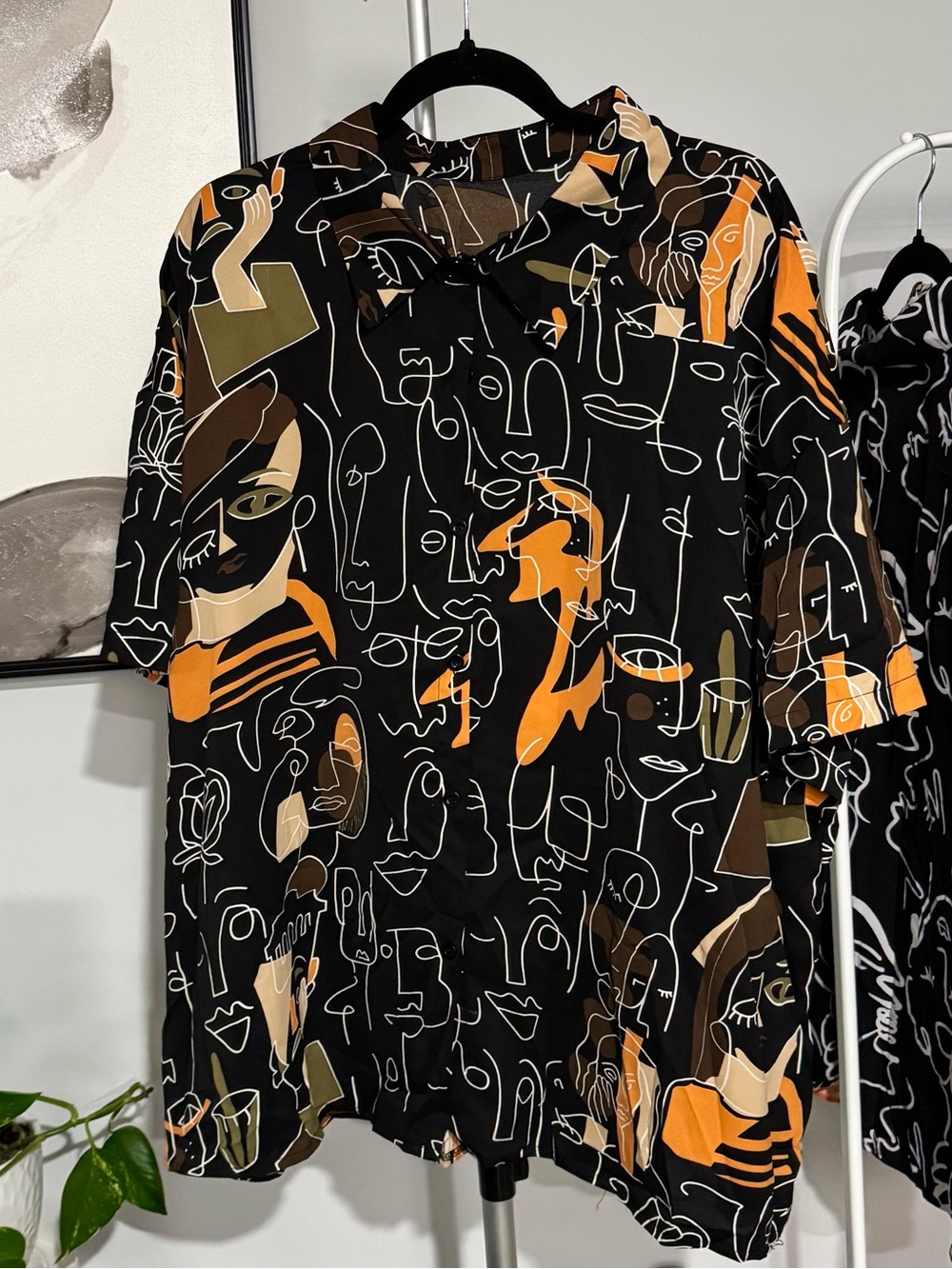 Abstract Face-Print Short Sleeve Blouse — Black & Orange